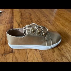 Brand new gold sneakers never worn.